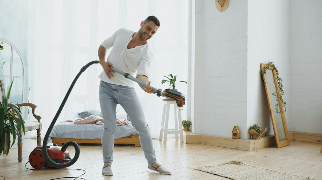 vacuuming rug at home